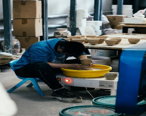 Ceramic artist working in a studio
